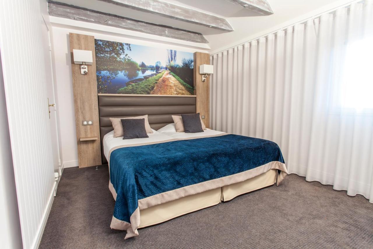 Logis - Le Christina Hotel Bourges Bagian luar foto
